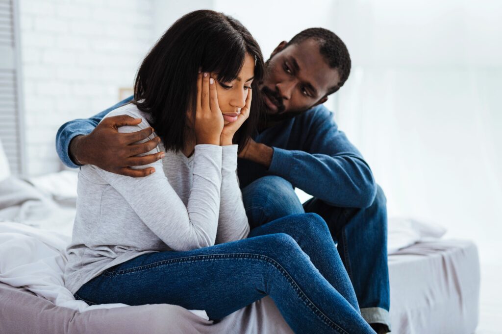 Supportive partner comforting their loved one, illustrating empathy and trust-building in relationships.